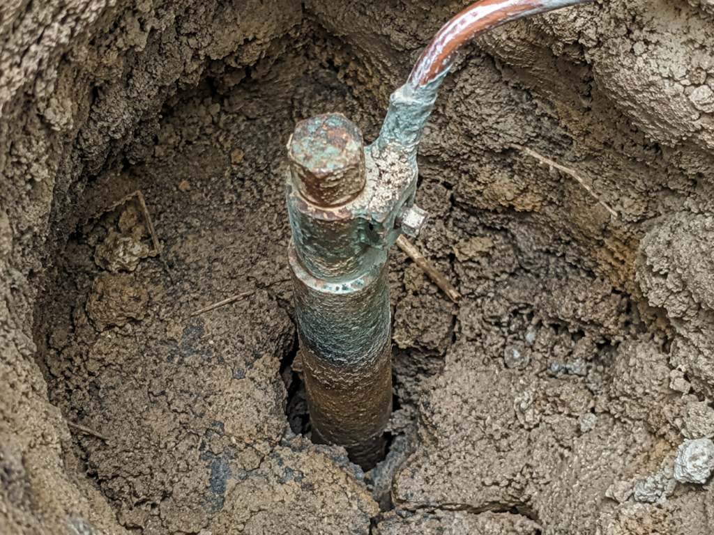 corroded copper and steel electrical grounding rod